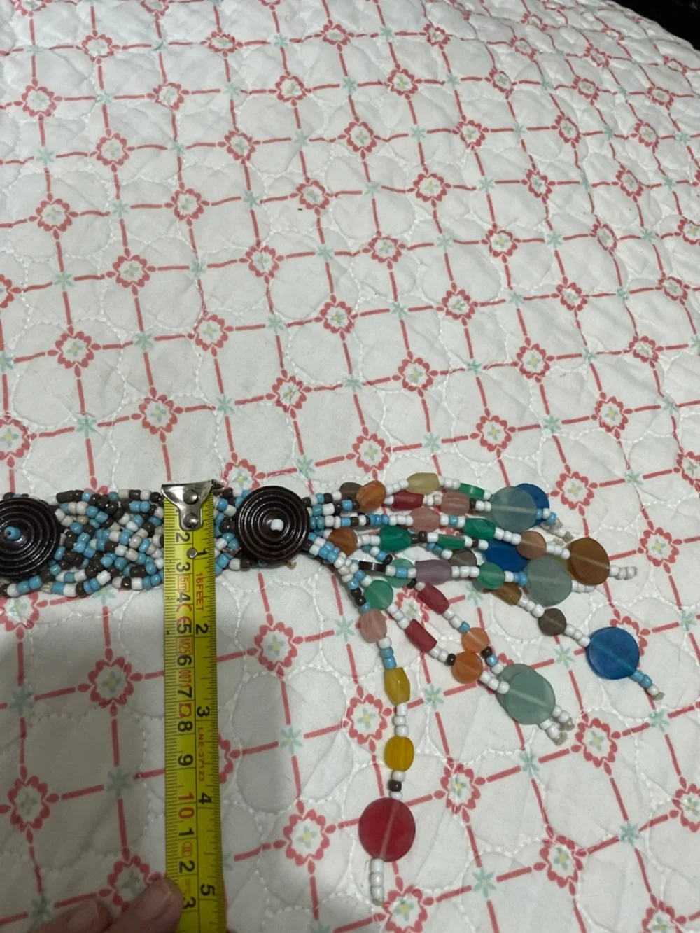 Woven beaded and tassel belt